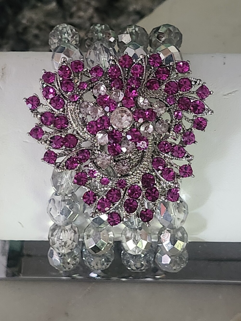 Four Strand Clear Crystal Bead Bracelet with Fuchsia Rhinestone Floral Accent